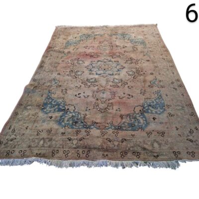 Handmade antique turkish Oushak style carpet with faded wool in shades of pink and blue for rent for events, advertising, films and series.