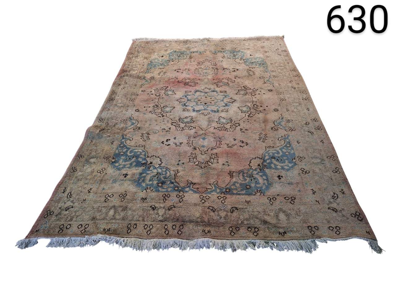 Handmade antique turkish Oushak style carpet with faded wool in shades of pink and blue for rent for events, advertising, films and series.