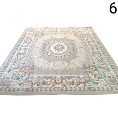 Beige carpet with floral design is a classic style piece, possibly inspired by the French designs of Aubusson for rent for events, advertising, films and series.