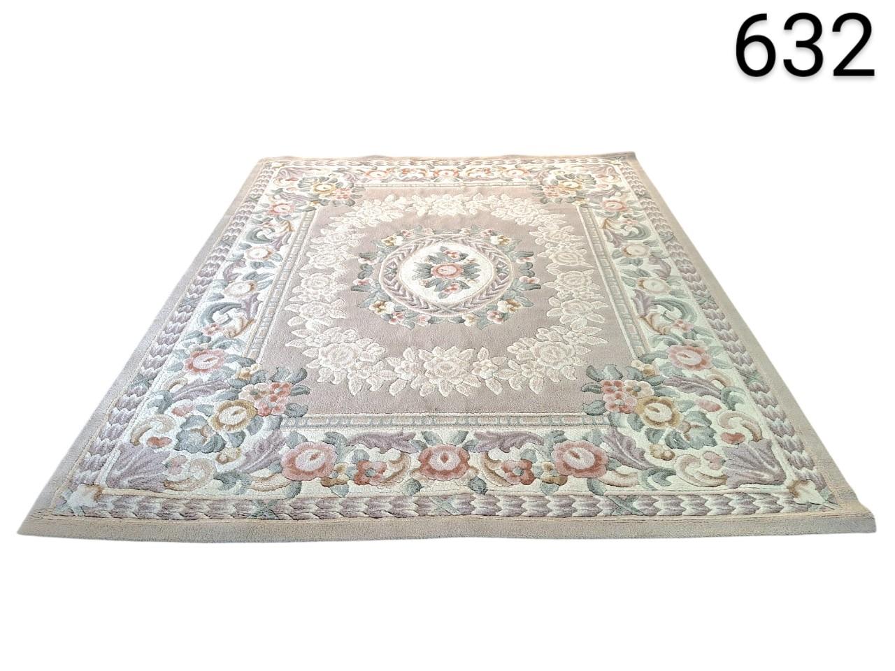 Beige carpet with floral design is a classic style piece, possibly inspired by the French designs of Aubusson for rent for events, advertising, films and series.