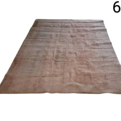 Hand knotted vintage turkish rug, characterised by its faded tone and subtle woven texture, rental for events, advertising, films and series.