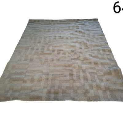 Modern rectangular rug with a geometric pattern in beige and neutral tones for rent for events, advertising, films and series.