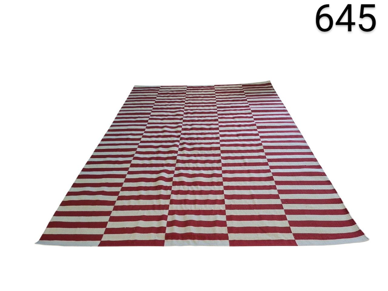 Red and white striped kilim rug is handmade with wool for rent for events, advertising, films and series.