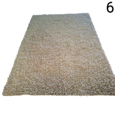 Long pile carpet, commonly known as shaggy type, is light beige in colour and is synthetically manufactured, for events, advertising, films and series.