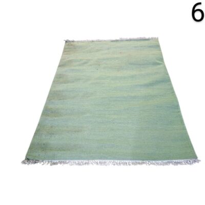 Moroccan hand-woven wool Kilim rug in mint green and aqua shades for rent for events, advertising, films and series.