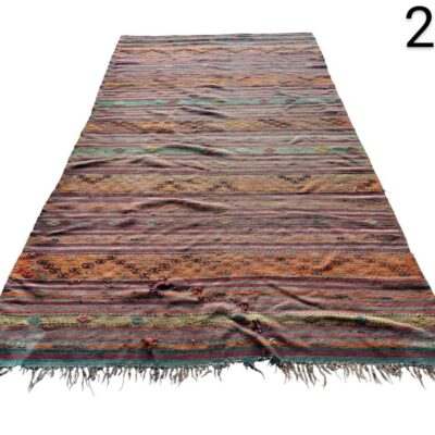 Turkish or Afghani Kilim rug, hand-woven with geometric patterns and vibrant colours for rent for events, advertising, films and series.