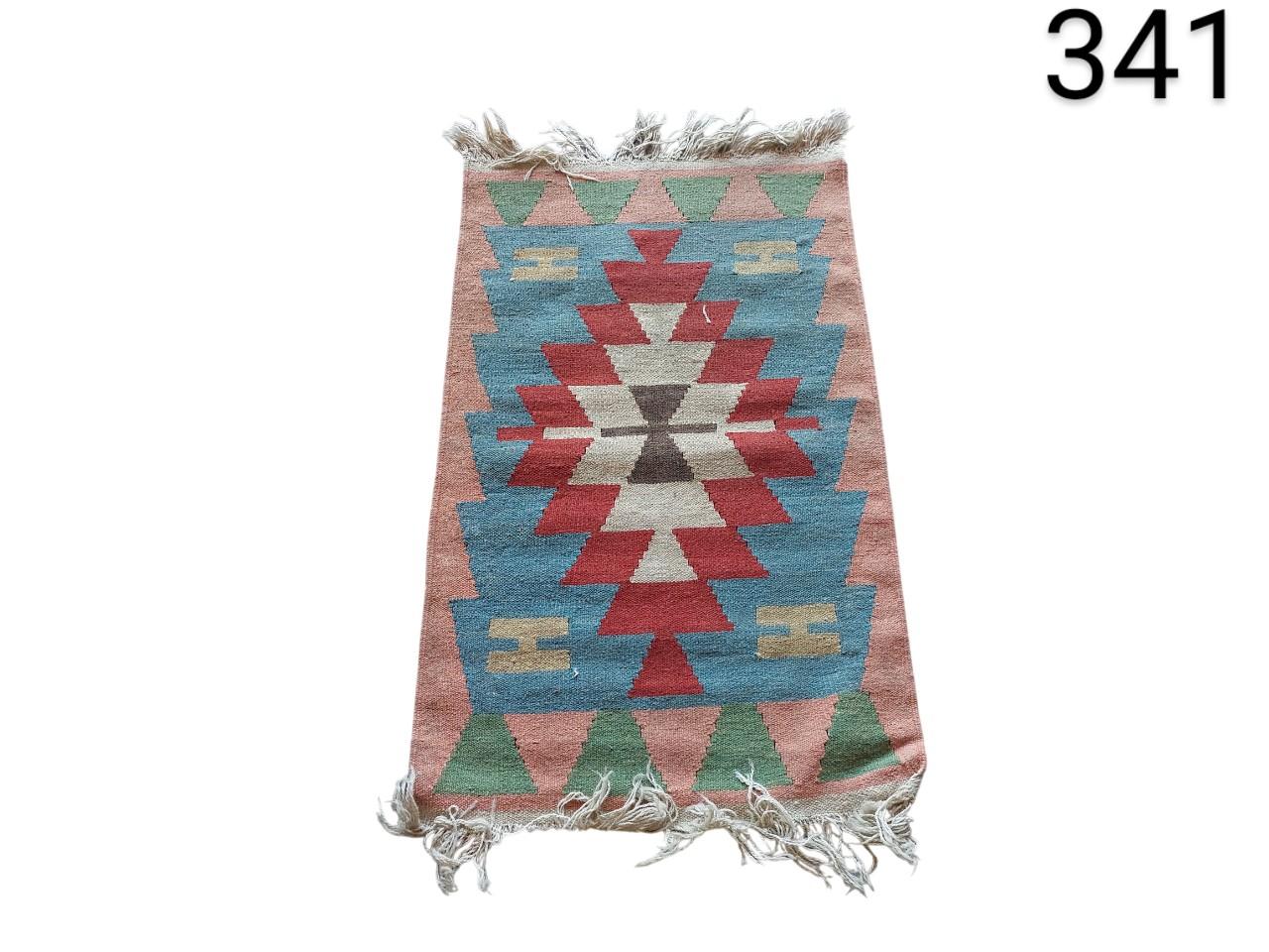Vintage Turkish Kilim wool rug with an ethnic and geometric design in red and blue tones for rent for events, advertising, films and series.
