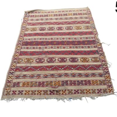 Vintage hand-woven Kilim rug with a geometric striped pattern, possibly of Turkish or Moroccan origin, for rent for events, advertising, films and series.