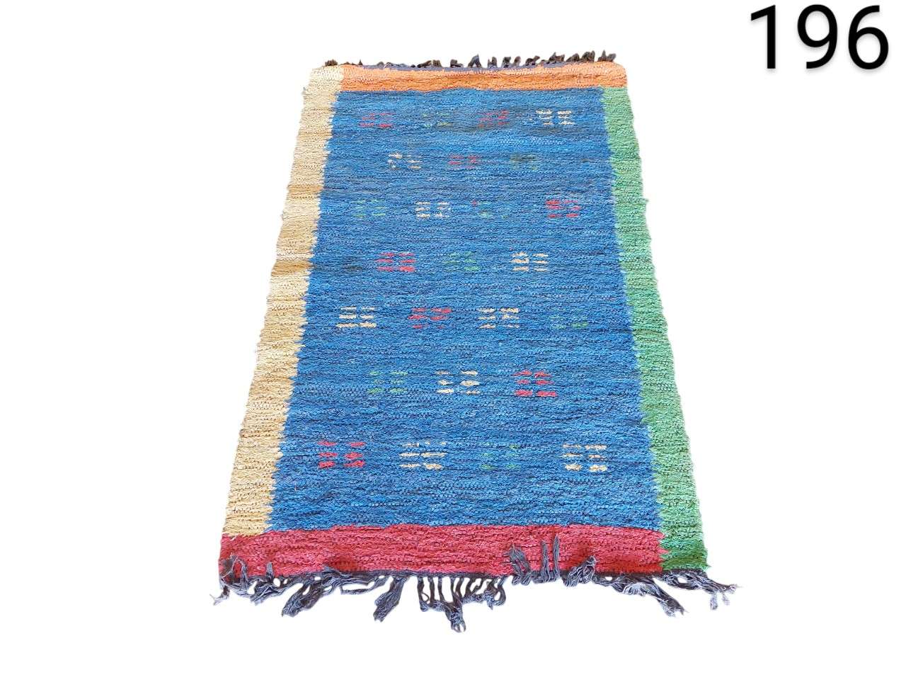 Blue Moroccan Berber rug handmade with wool and a tribal geometric design for rent for events, advertising, films and series.