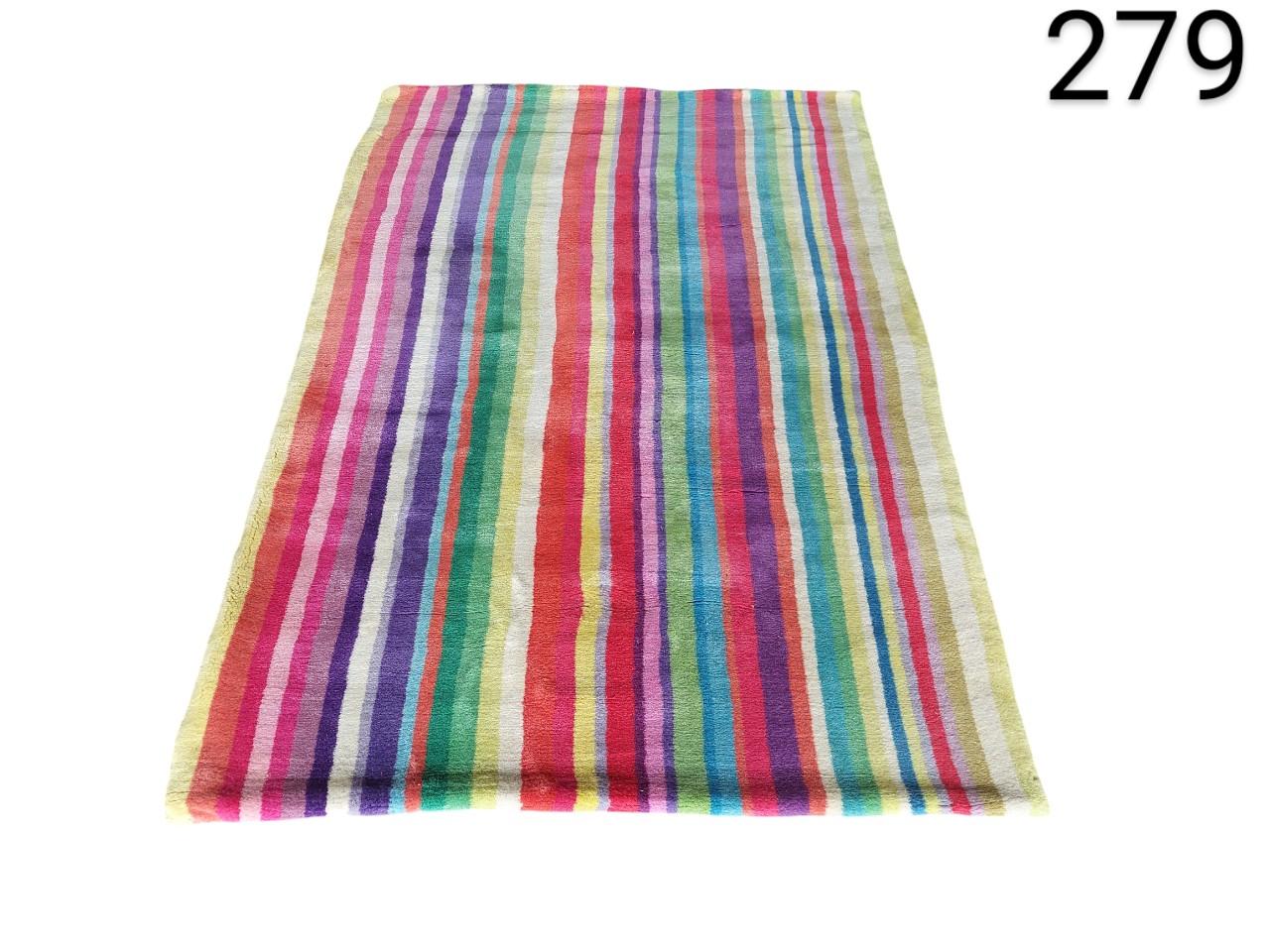 Multicoloured wool carpet with Ikea style stripes for rent for events, advertising, films and series.