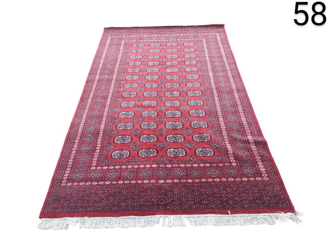 Carpet is a classic example of a traditional Bokhara design, characterised by its intense red colour and repetitive geometric patterns, rented for events, advertising, films and serials.