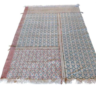 Multicoloured kilim carpet with geometric design and fringes on the ends for rent for events, advertising, films and series.
