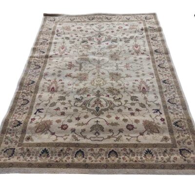 Beige vintage persian carpet with floral print detailed for rent for events, advertising, movies and series.