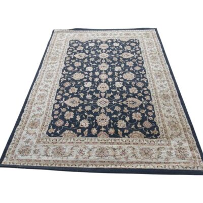 Rectangular Persian style rug from the Rubine collection in navy blue with intricate floral patterns in shades of beige and cream for rent for events, advertising, films and series