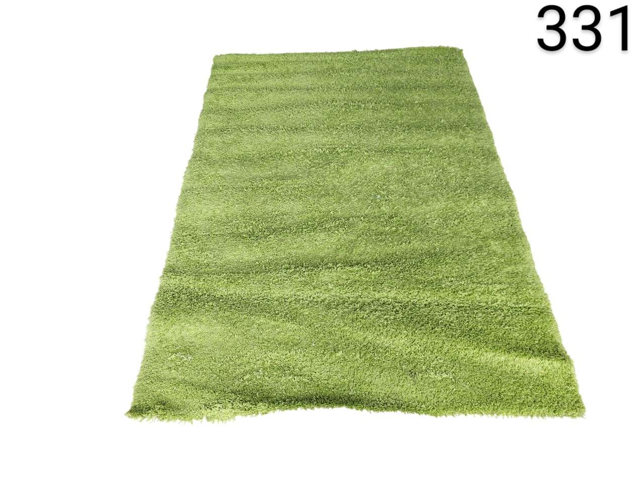Alfombra shaggy de color verde de pelo largo de la marca Traum para sala de estar alquiler para eventos, publicidad, peliculas y series