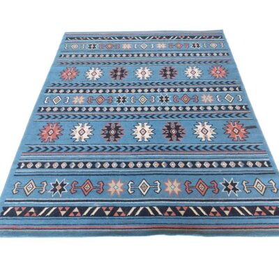 Kilim carpet with geometric design and blue tones for rent for events, advertising, films and series.