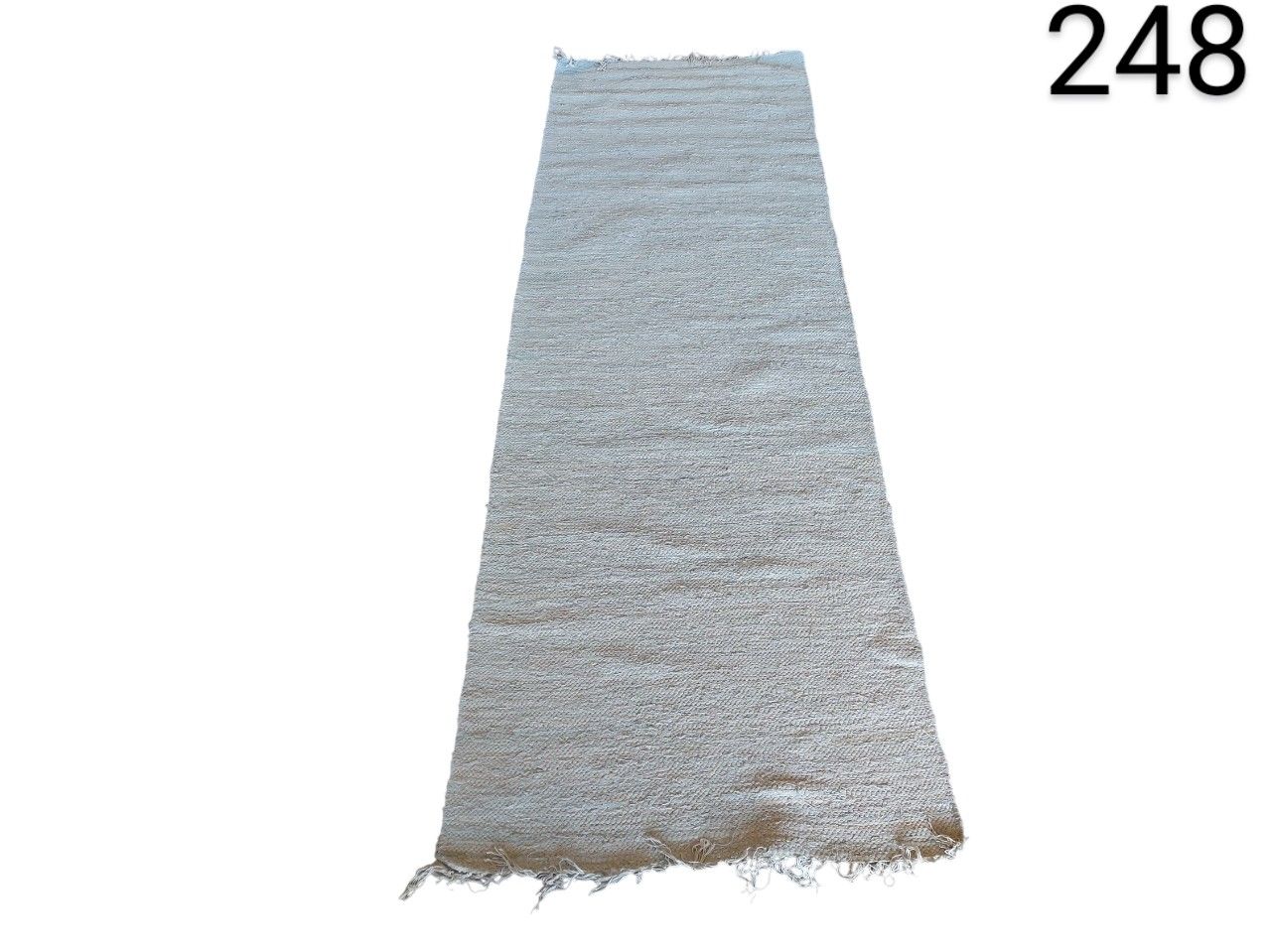 Off-white carpet with fringes on the ends for rent for events, advertising, films and series.