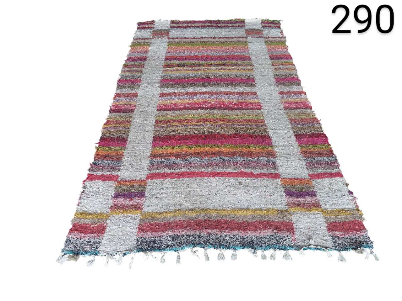 Vintage kilim rug with a colourful striped design and fringes for rent for events, advertising, films and series.