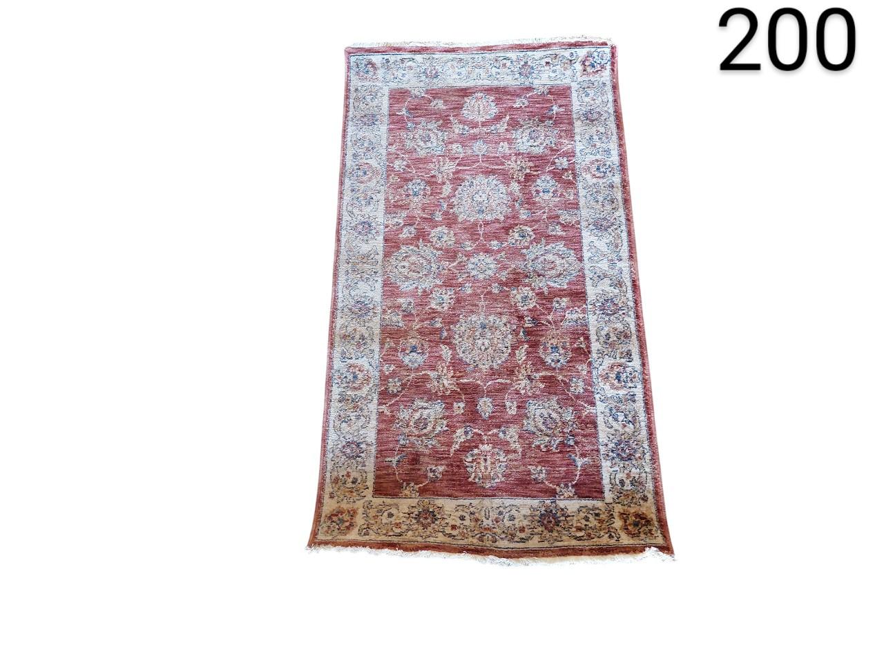 Vintage turkish style carpet in pink and cream tones for rent for events, advertising, movies and series.