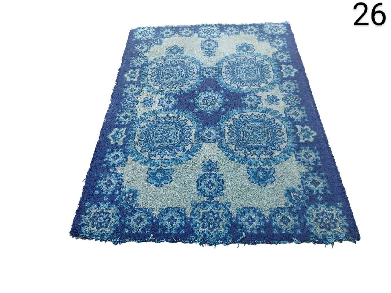 Turkish vintage blue vintage rug from Safavieh's Madison collection with a worn medallion pattern for rent for events, advertising, films and series.