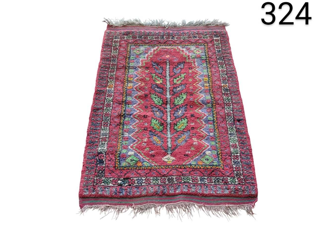 Turkish handmade woollen carpet with a central floral design in prayer style for rent for events, advertising, films and series.