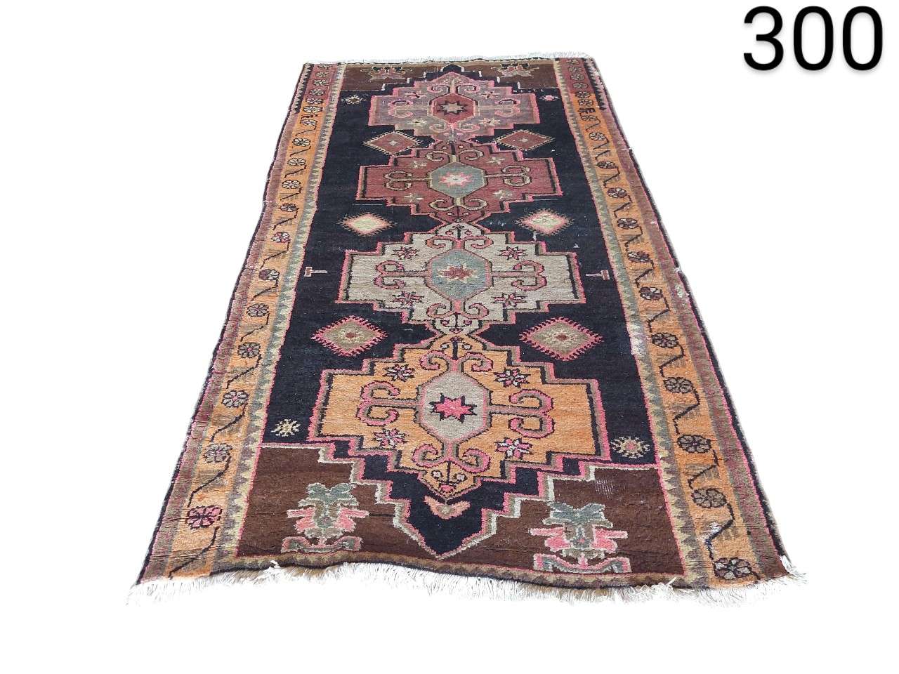 Turkish vintage kilim wool rug with geometric design and worn effect for rent for events, advertising, films and series.