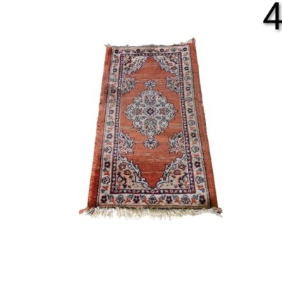 Small Persian or Turkish style hand knotted carpet, with a central floral medallion design in rust red and beige colours, for rent for events, advertising, film and series.