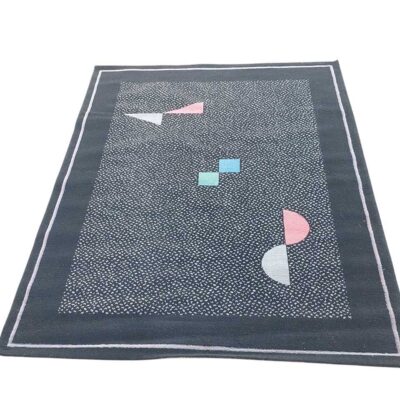 alfombra geométrica contemporánea con un patrón abstracto de formas en tonos pastel sobre un fondo oscuro