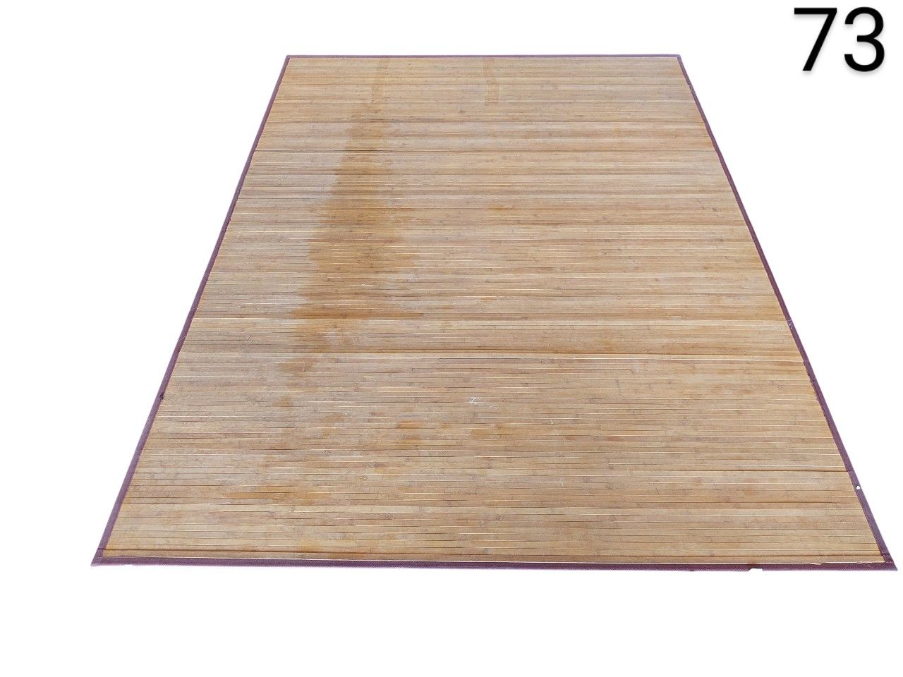 Natural khaki bamboo carpet with polypropylene textile border, event, advertising, film and series rental.