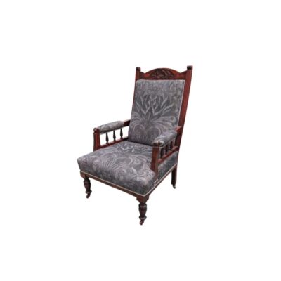 Neo-Renaissance-style walnut armchair with a high backrest upholstered in fabric decorated with natural motifs; available for hire for events, advertising, films and TV series