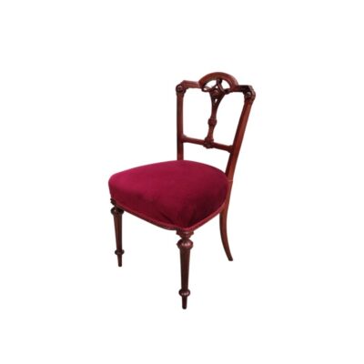 Victorian-style chair with a dark wooden frame and a seat upholstered in red velvet – available for hire for events, advertising, films and TV series