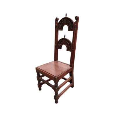 Antique carved wooden chair featuring decorative arched backrests and turned legs, characteristics consistent with 17th-century Yorkshire or Derbyshire styles; available for hire for events, advertising, films and TV series
