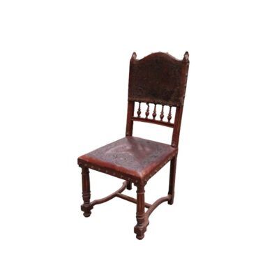 Antique Henry II-style chair featuring a backrest and seat upholstered in embossed leather with decorative studs; available for hire for events, advertising, films and TV series