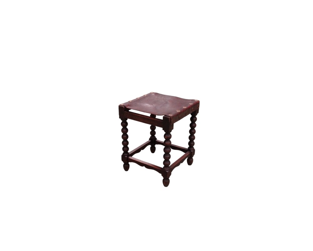 Antique wooden and leather stool featuring a traditional Spanish design with turned, spindle-shaped legs; available for hire for events, advertising, films and TV series