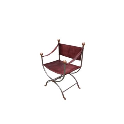 Vintage-style curul or Savonarola chair, characterised by its wrought-iron frame and leather seat; available for hire for events, advertising, films and TV series