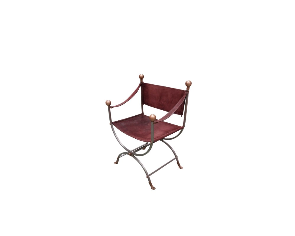 Vintage-style curul or Savonarola chair, characterised by its wrought-iron frame and leather seat; available for hire for events, advertising, films and TV series