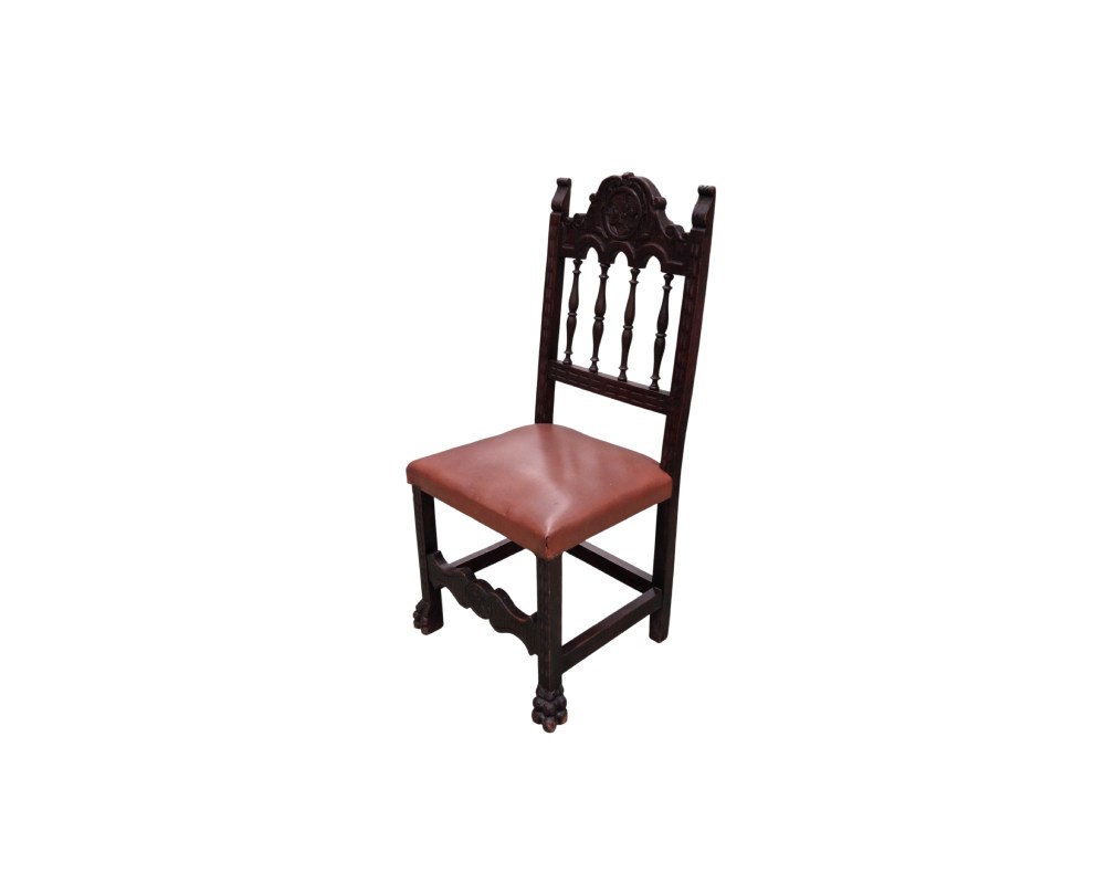 An antique Renaissance-style chair featuring a carved backrest and a leather seat, available for hire for events, advertising, films and TV series