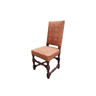 This Louis XIV-style dining chair is made of oak and features upholstery with an intricate pattern; available for hire for events, advertising, films and TV series