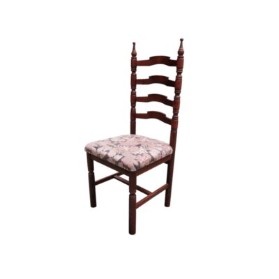 Antique Sevillian chair featuring a carved wooden frame and a seat upholstered with a floral pattern; available for hire for events, advertising, films and TV series