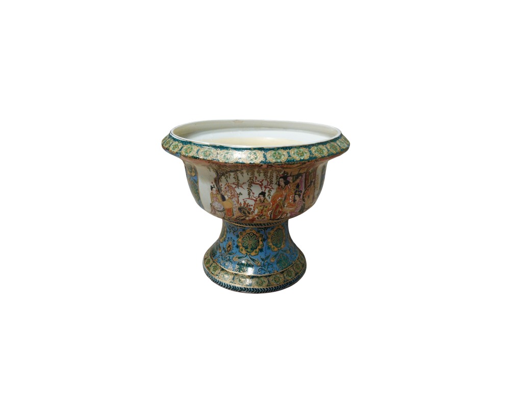 A ceramic cup with a wide base and flared rim, characterised by rich polychrome decoration featuring scenes of traditional figures on the body, an upper rim with ornamental borders, and a foot with floral patterns in shades of blue and gold; available for hire for events, advertising, films and TV series