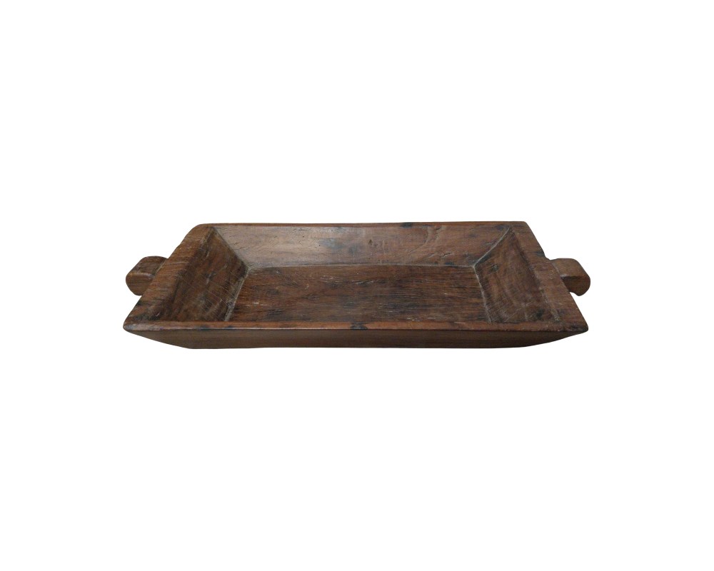 A rectangular tray, handcrafted from solid wood, which retains a rustic, natural finish that highlights the grain and texture of the material. It features bevelled edges and two integrated side handles, giving it a functional and robust design. Available for hire for events, advertising, films and TV series.