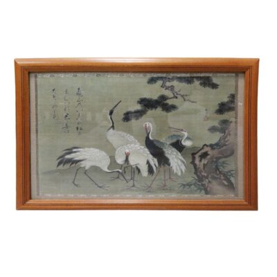 A work of art framed in light-coloured wood, featuring an oriental-style print depicting a flock of cranes in a natural setting alongside a gnarled tree, against a subtle background with calligraphic inscriptions. Available for hire for events, advertising, films and TV series.