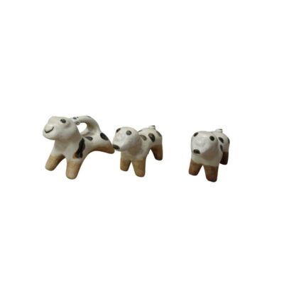 The set comprises ten small ceramic figurines in a rustic style with simplified shapes, finished in light colours and decorated with dark spots and brown details on the legs. Available for hire for events, advertising, films and TV series.