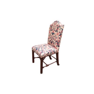 A Louis XIII-style chair, crafted from oak, featuring upholstery with a multicoloured floral pattern and a moulded border. Available for hire for events, advertising, films and TV series.