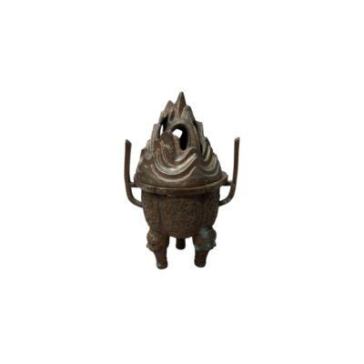 A bronze censer with a dark, antiqued finish, characterised by a spherical body resting on three legs, two vertical handles on the sides and an elaborately sculpted lid featuring designs resembling mountains or rock formations. Available for hire for events, advertising, films and TV series