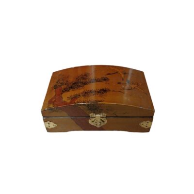 A wooden box with a warm brown finish and a distinctive arched lid, featuring painted decoration depicting a traditional pine tree and birds in flight, as well as metal fittings and an ornate metal clasp at the front; available for hire for events, advertising, films and TV series