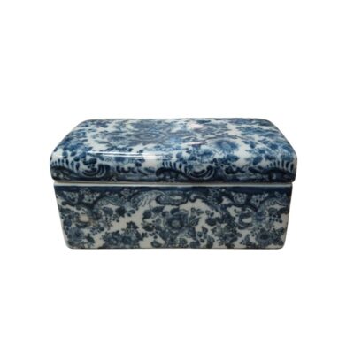 A rectangular porcelain box with a lid, entirely decorated using the traditional cobalt blue technique on a white background. The piece features a detailed and intricate design of intertwined floral and plant motifs covering both the lid and the body of the box. Available for hire for events, advertising, films and TV series.