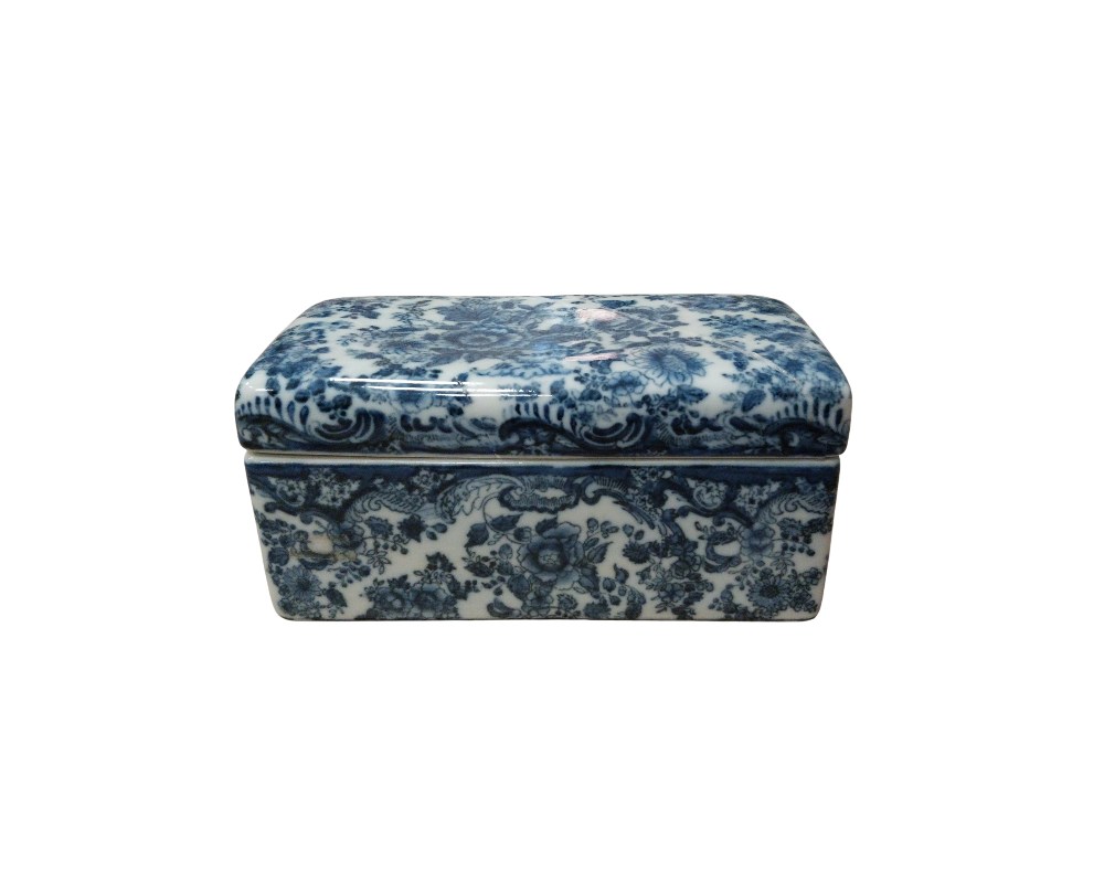 A rectangular porcelain box with a lid, entirely decorated using the traditional cobalt blue technique on a white background. The piece features a detailed and intricate design of intertwined floral and plant motifs covering both the lid and the body of the box. Available for hire for events, advertising, films and TV series.