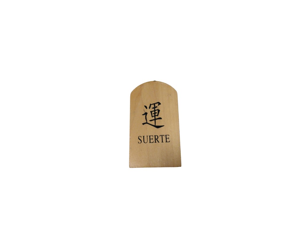A small, light-coloured wooden plaque, characterised by a rectangular shape with a rounded top and a front surface printed with a traditional ideogram at the top and the word ‘SUERTE’ in capital letters at the bottom; available for hire for events, advertising, films and TV series