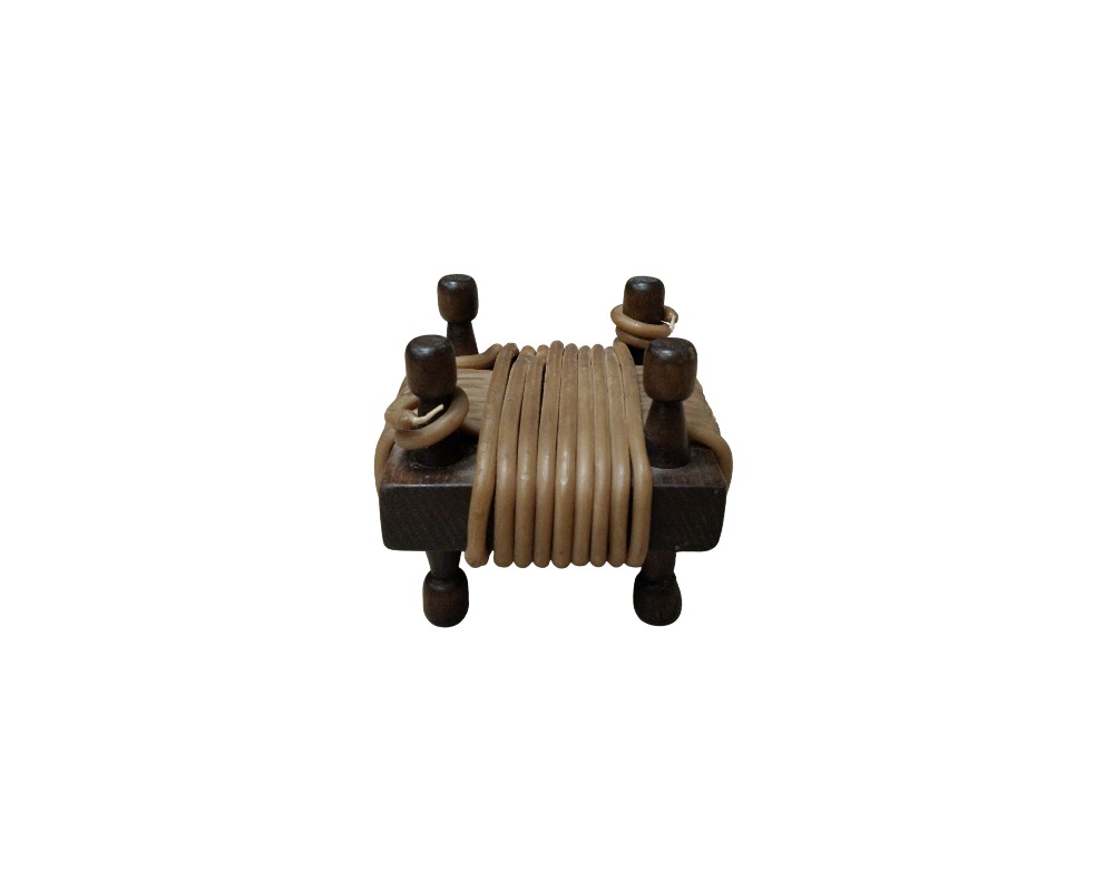 A dark wooden frame with four vertical supports and turned legs, around which a thick cord or filament in light shades is neatly wound; available for hire for events, advertising, films and TV series